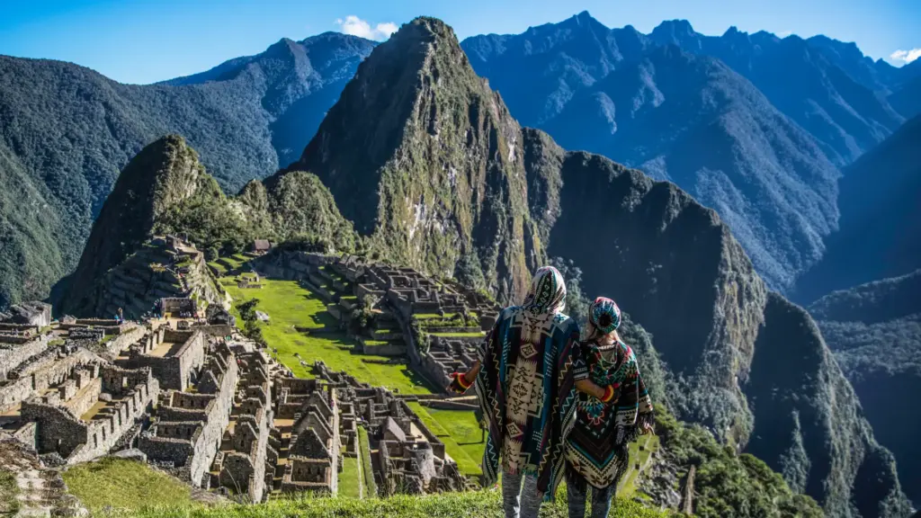 Travellers above the terraces of Machu Picchu